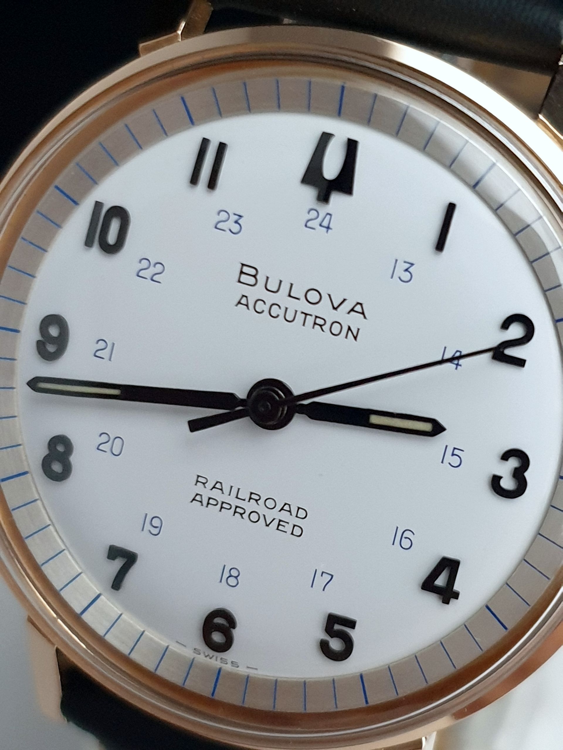 Close-up of a Bulova Accutron Railroad Approved wristwatch with a white dial and rose-gold bezel.