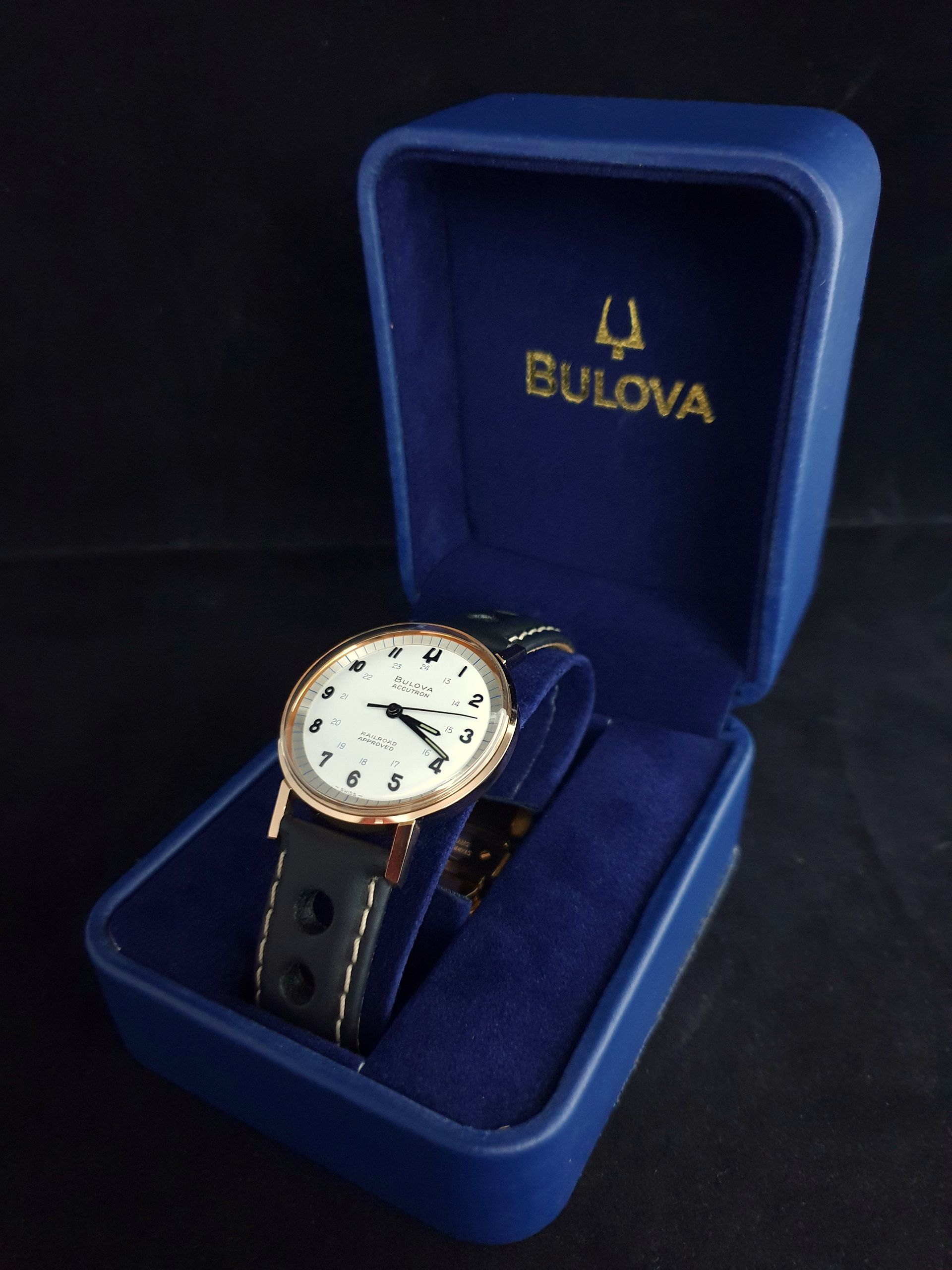 Bulova wristwatch with black leather strap in a blue presentation box