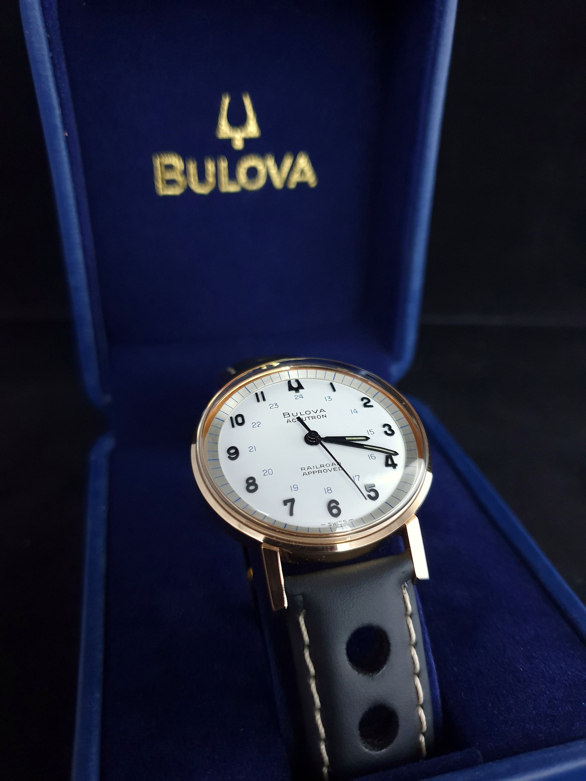 Bulova wristwatch with black leather strap in blue presentation box