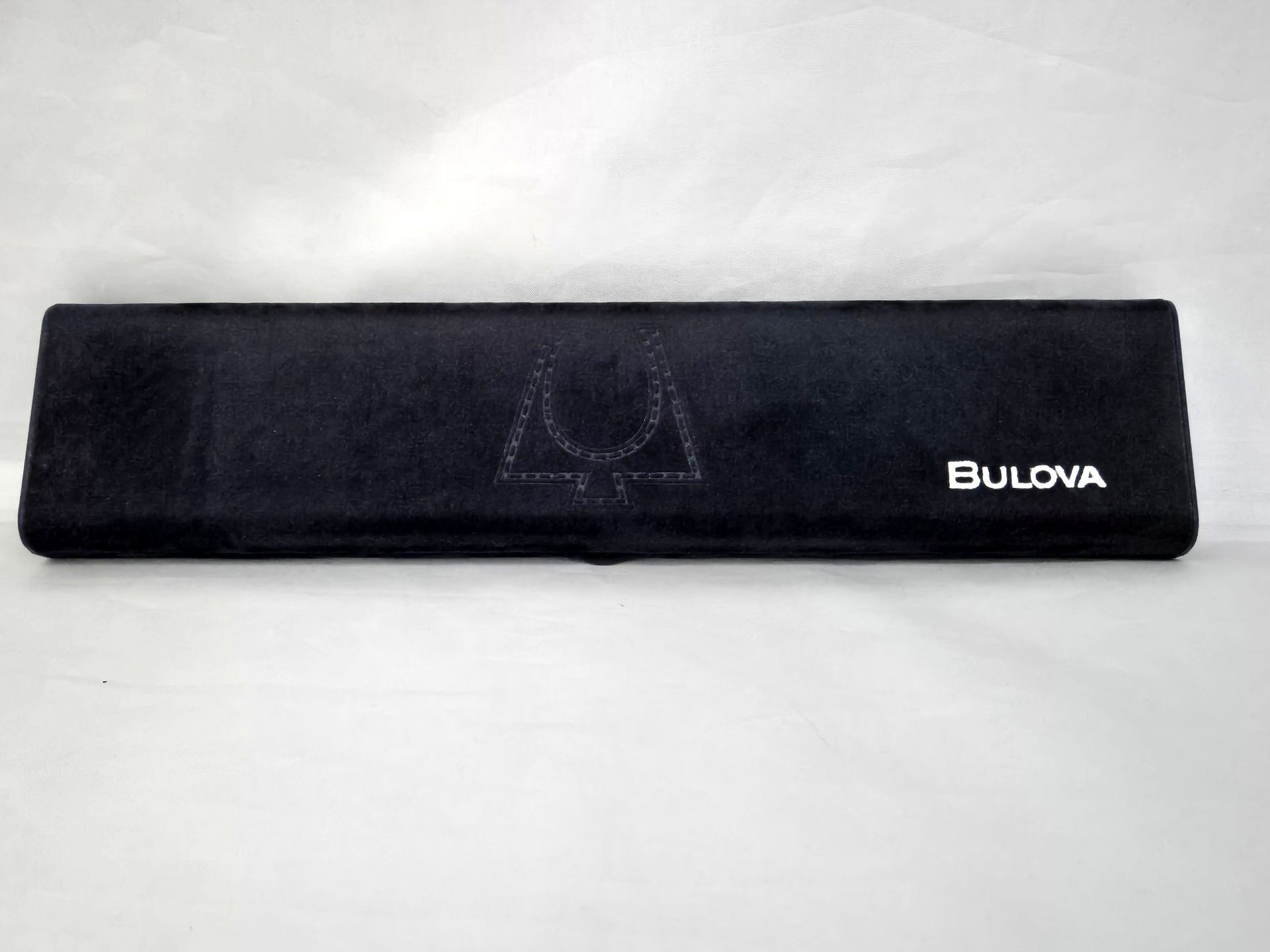 Black Bulova watch case with logo on white background