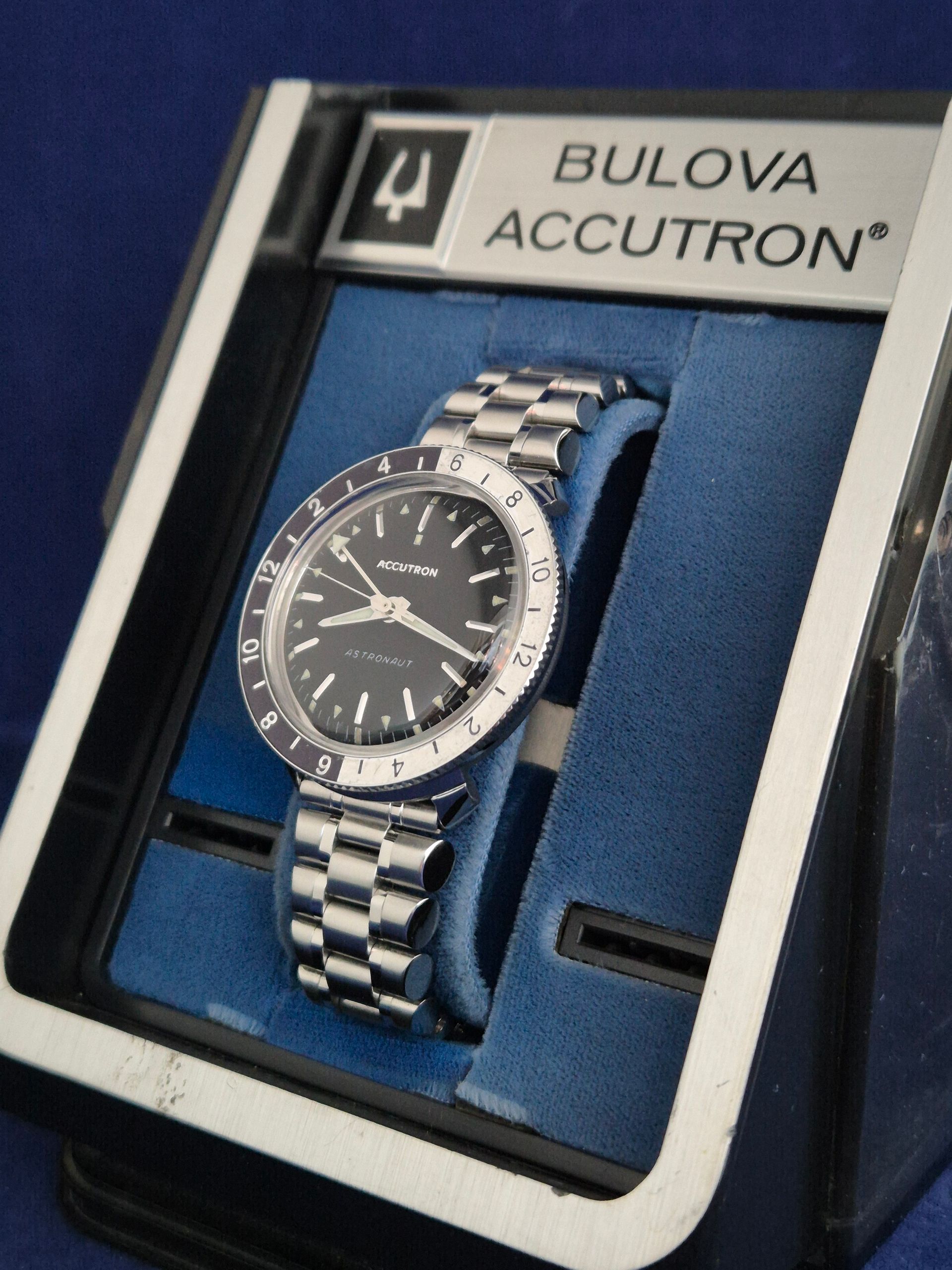 Bulova Accutron watch in a blue display box with silver bracelet and black dial