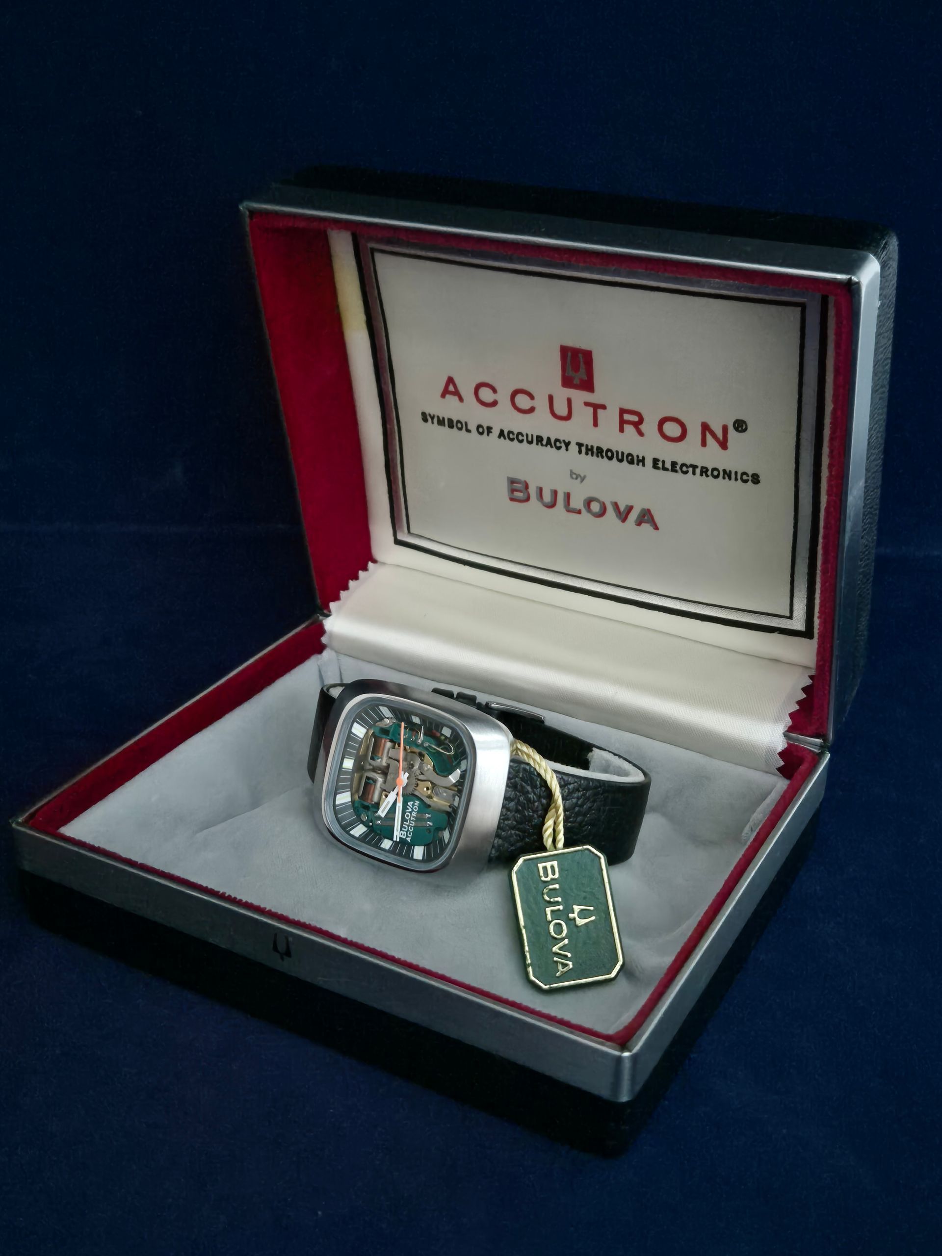 Bulova Accutron watch in red presentation box with green hang tag