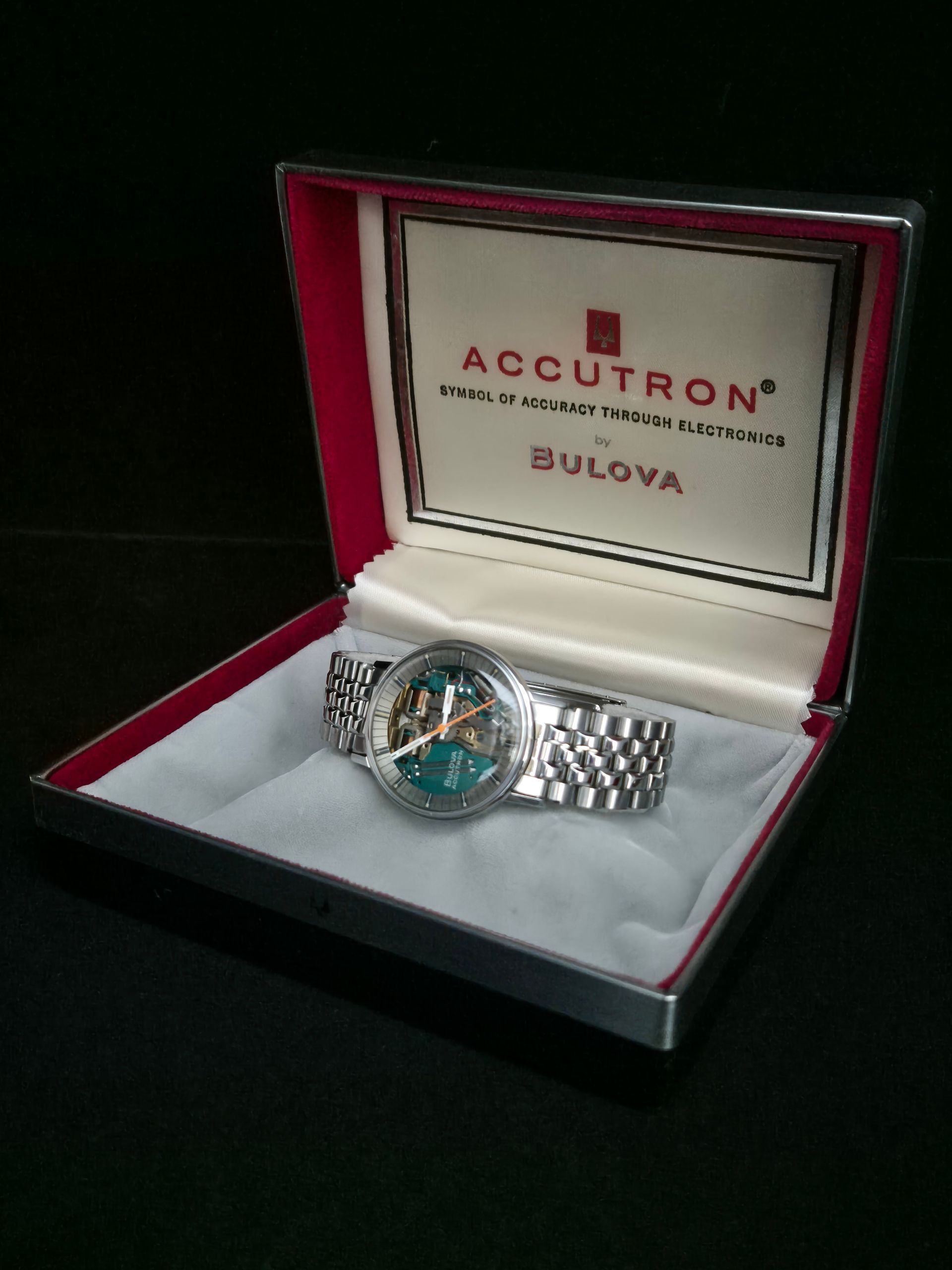 Bulova Accutron watch in a red-lined presentation box against a dark background