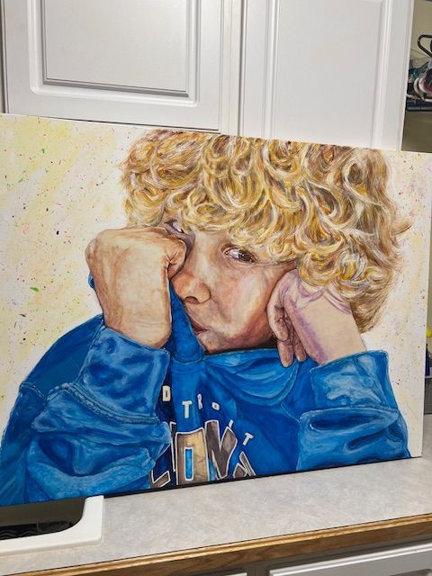 A painting of a young boy with curly hair wearing a blue hoodie.