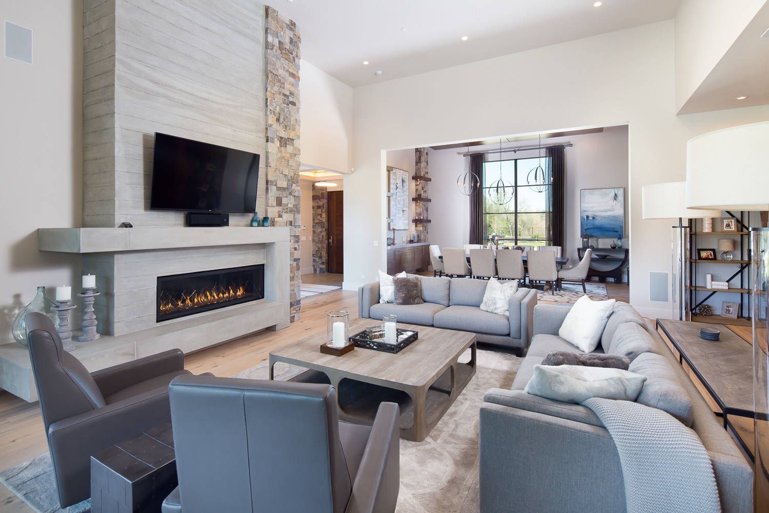 A living room filled with furniture and a fireplace.