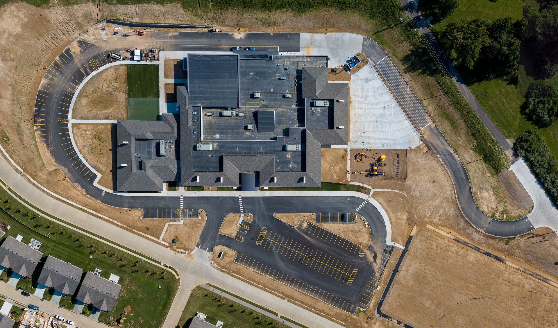 Parking lot showing multiple cars from a birds eye view
