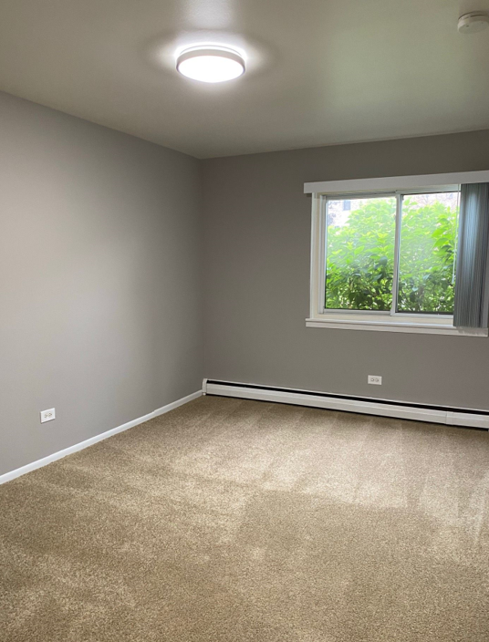 There is a large window in the middle of the room.