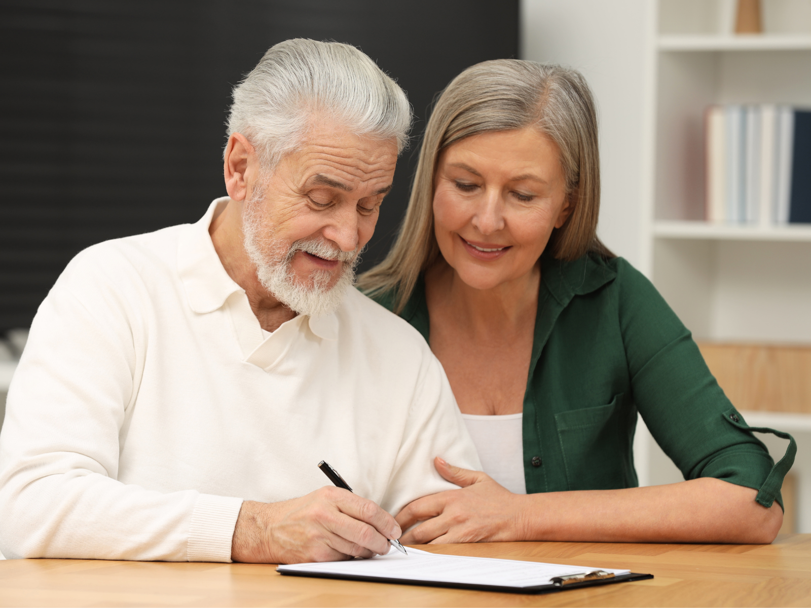 Tax forms, pen, and notebook with notes for 2019 tax preparation.