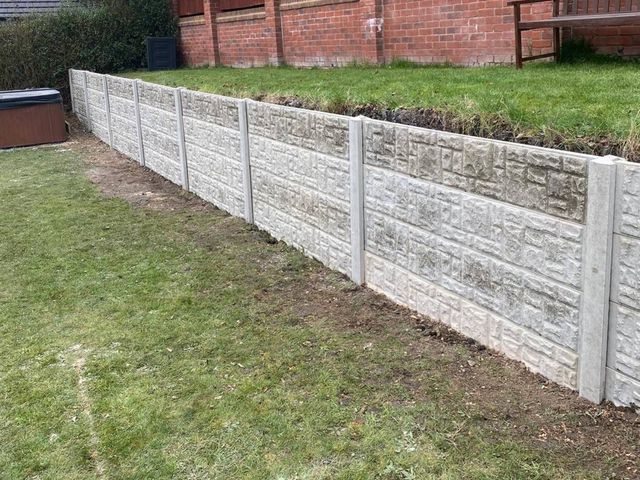 The finished retaining run seen from the lower level of the garden in Ilkeston, with level lawn above