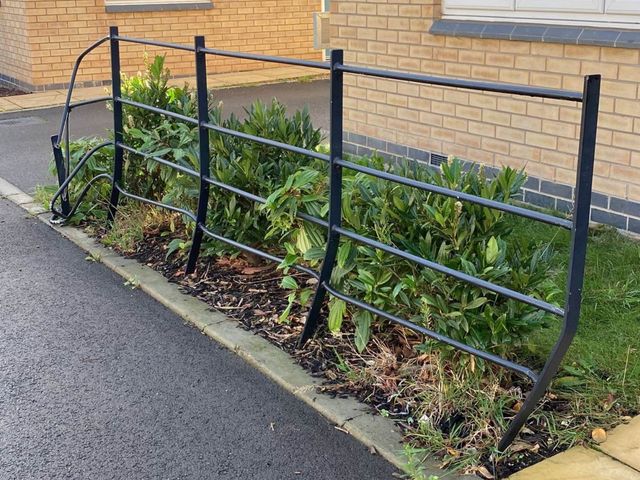 Damaged wrought iron railings in Beechdale, Nottingham, before repair