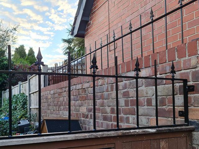 Metal railings and matching gate on a garden wall in Nottingham
