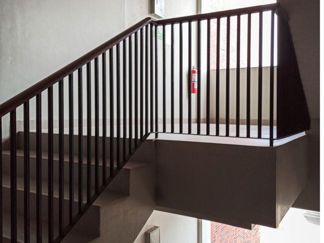 Commercial office staircase metal handrailing