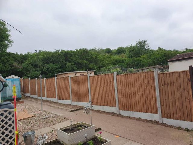 A completed run of closeboard fencing on concrete posts and gravel boards along the same Sneinton boundary
