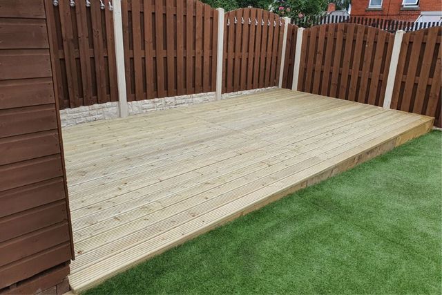 Decking boards being fitted onto the completed joist frame in a West Bridgford garden