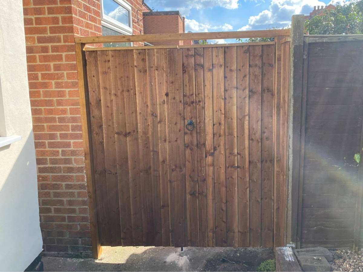 wooden gates with additional wooden framing