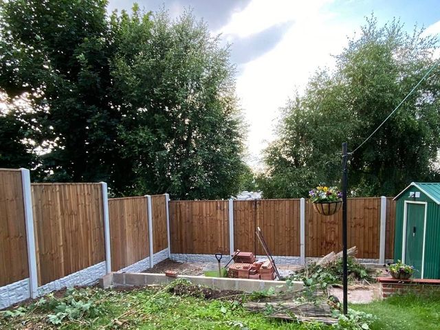 Replacement rear garden fencing on concrete posts and rock-faced gravel boards in a Lenton garden