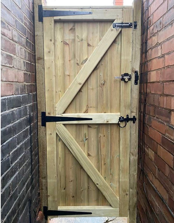 wooden gate with black ironmongery in Nottingham
