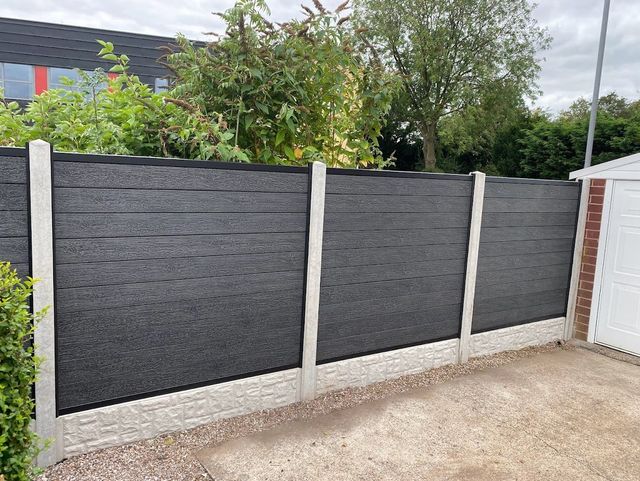 Anthracite composite fence panels between concrete posts with gravel boards in Chilwell