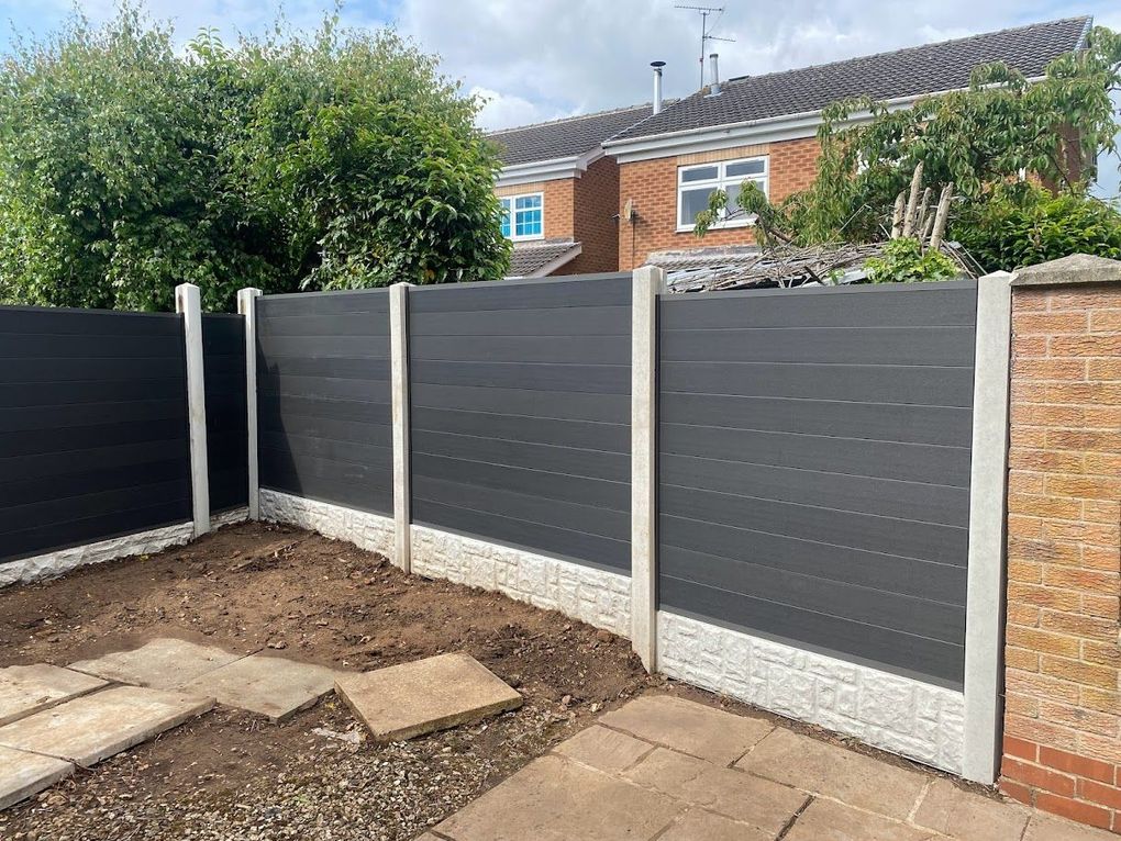 Anthracite grey composite fence panels between concrete posts and gravel boards in Chilwell