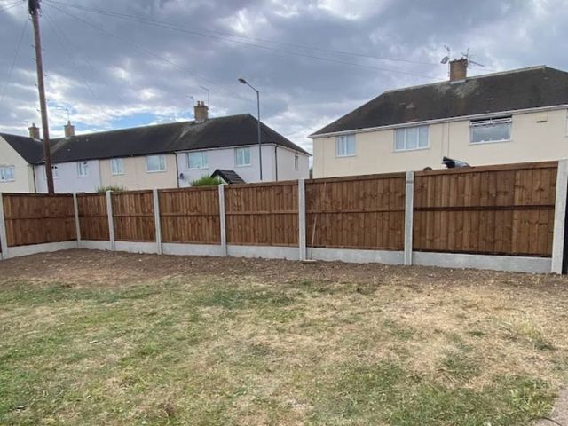 A full run of closeboard fencing on concrete posts with gravel boards around a rear garden on a Clifton estate