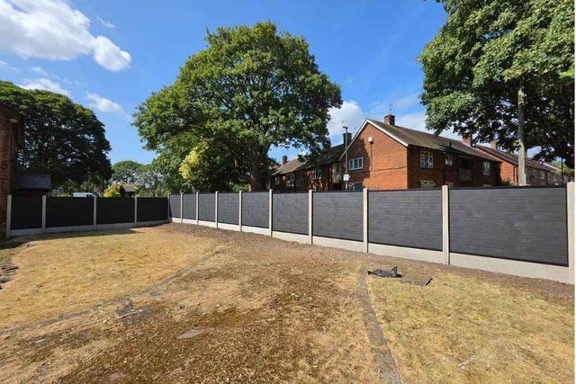 Anthracite grey composite fence panels fitted into new concrete posts with smooth-faced gravel boards in Sutton-in-Ashfield