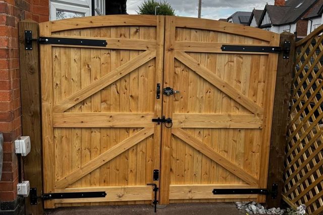 The braced inner frame of arched timber double gates fitted in West Bridgford