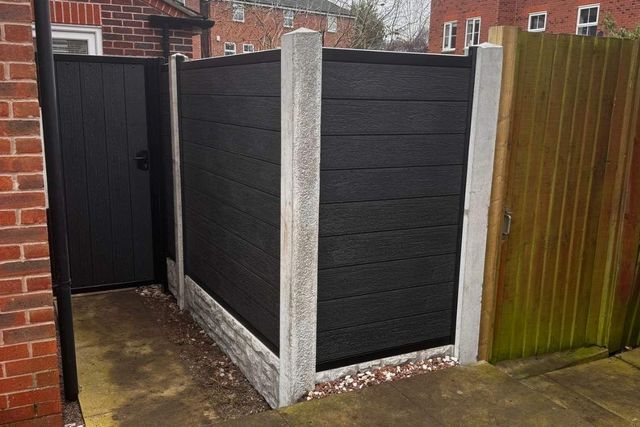 Black composite fencing on concrete posts with a matching composite gate in West Bridgford
