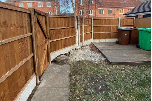 Closeboard fencing with a ledged and braced timber gate in a Bulwell rear garden