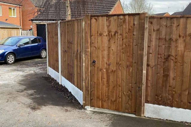 New closeboard fencing and a timber gate on a modern estate in Bulwell