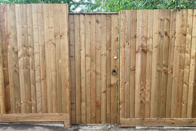 Closeboard fence panels with a matching timber gate and ring latch fitted in Arnold