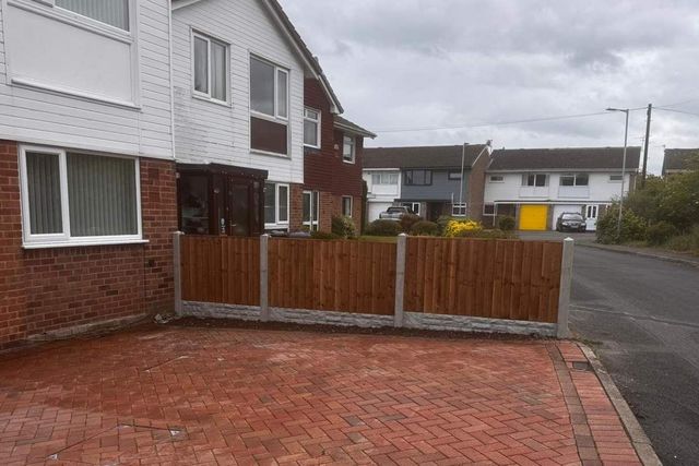 New closeboard fencing on concrete posts along a front driveway boundary in West Bridgford