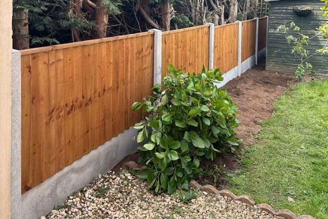 New closeboard fence panels on concrete posts with gravel boards in a rear garden in Forest Town