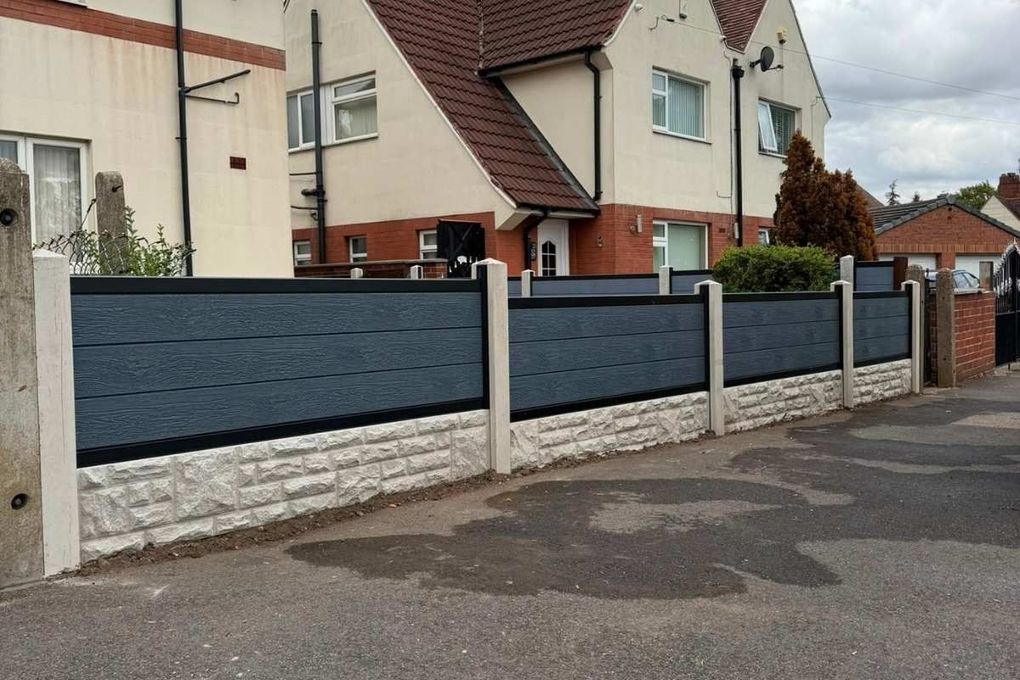 A run of anthracite composite fencing along a front boundary in Bulwell