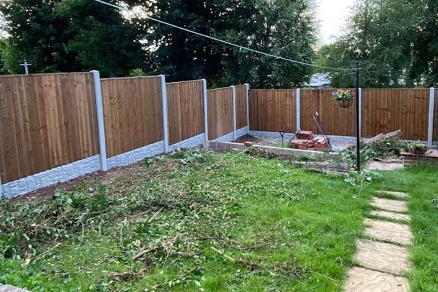 New closeboard fencing on concrete posts along a cleared rear garden boundary in West Bridgford