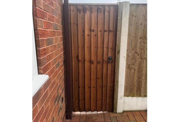 A new timber side gate in a metal frame fitted in West Bridgford