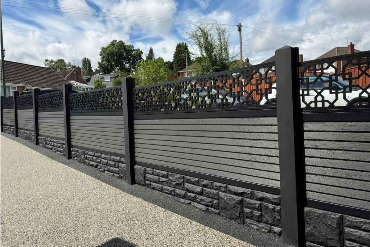 Anthracite grey composite fence panels with decorative screen toppers and rock-faced gravel boards installed by Nottingham Fencing