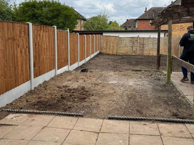 The same Arnold garden cleared to bare soil with new closeboard fencing on concrete posts fitted down both boundaries