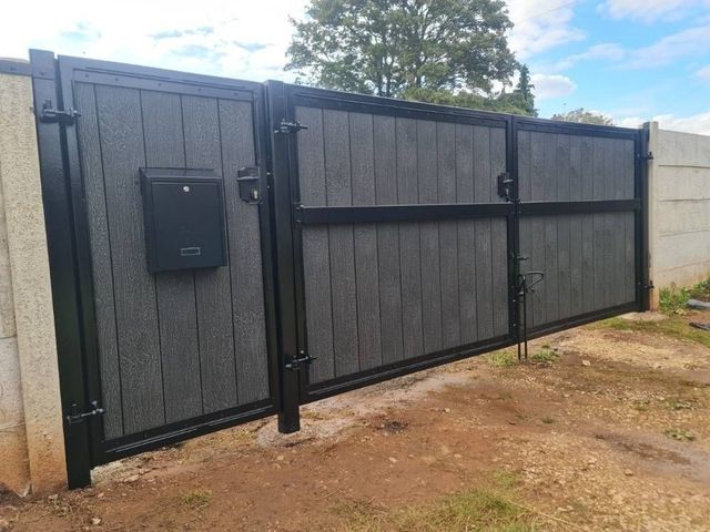 Inside view of composite driveway and pedestrian gates showing the postbox and gate frames