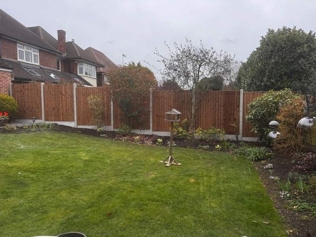 Replacement closeboard fence panels with plain smooth gravel boards in concrete posts around a rear garden in Wollaton