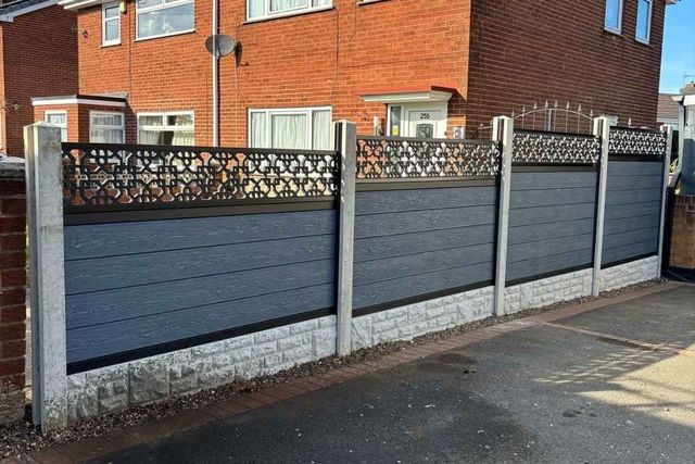 Silver grey composite fencing forming a front boundary outside a brick house in Mansfield