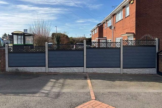 Silver grey composite fencing with decorative screen toppers along a driveway in Mansfield