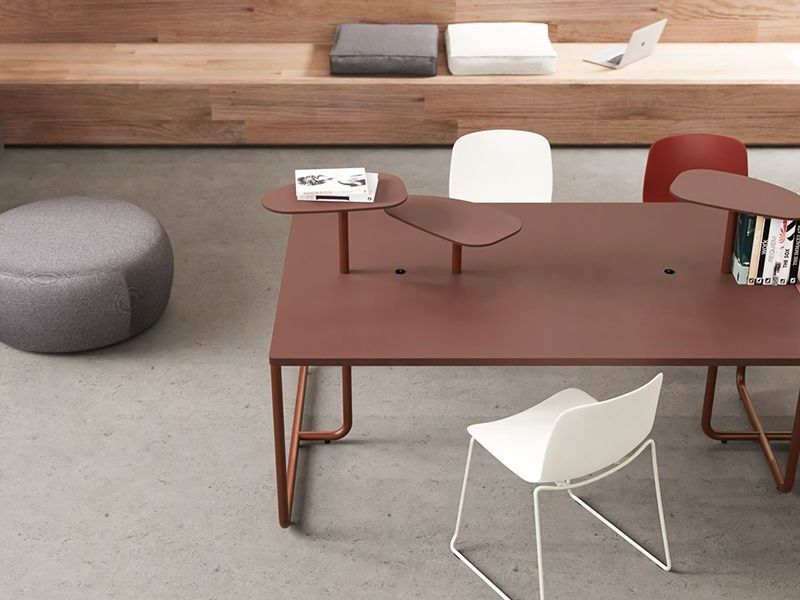 Alea Itube back to back bench desking with integrated fabric screen, lighting and shelves. The desk is a dark green. The backdrop is a green-grey colour.