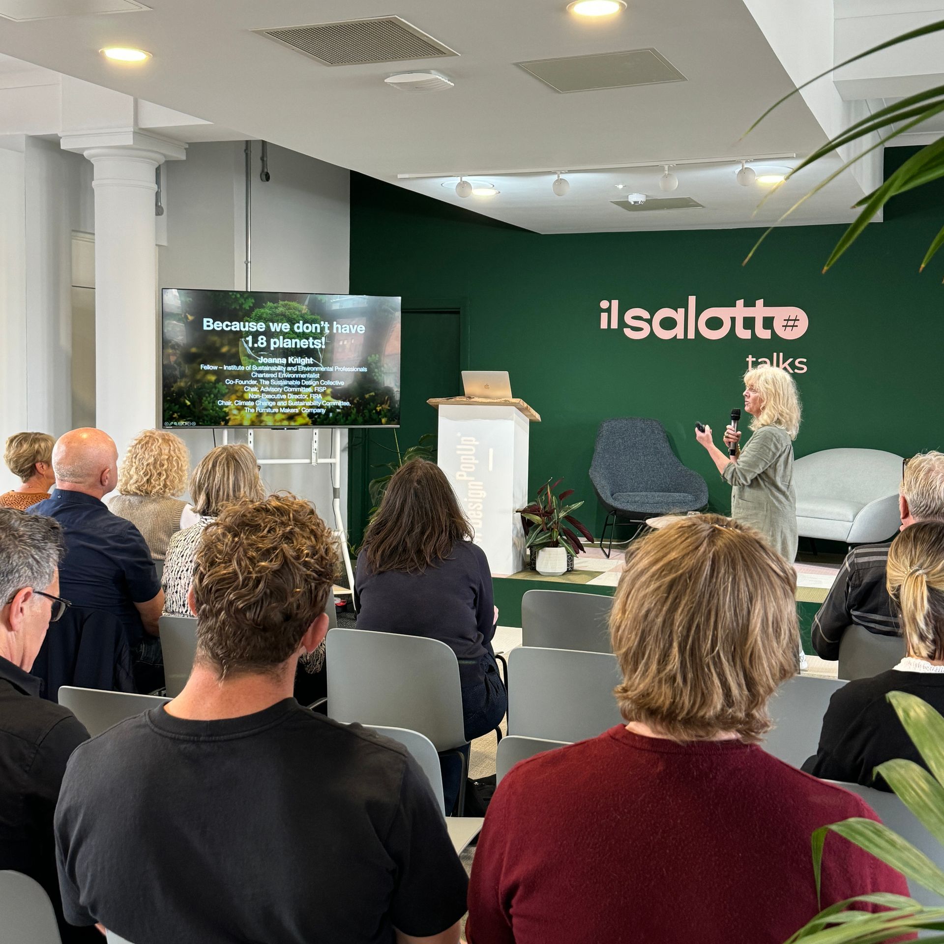 A woman presents a talk at
