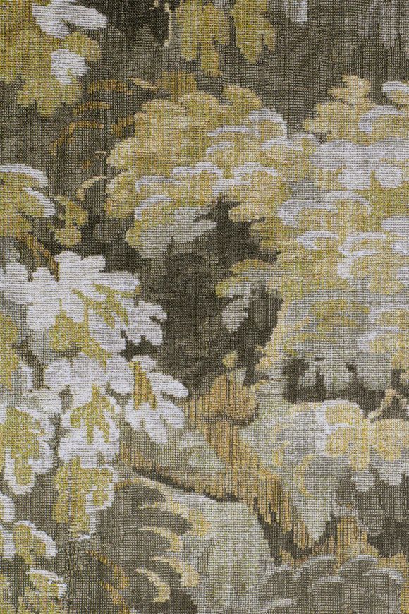 Tapestry with abstract floral design in shades of green, yellow, and gray.