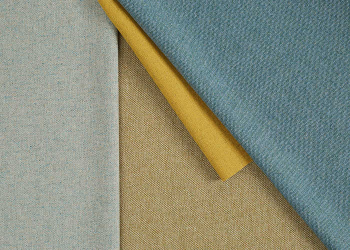 Three fabric swatches: light blue, beige, and yellow, arranged diagonally to overlap each other.