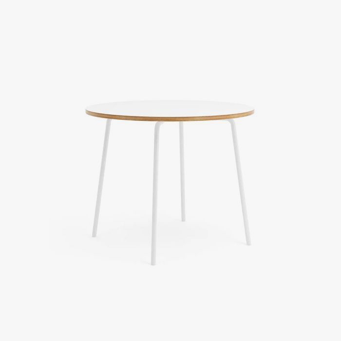 White round table with white legs on a white background.