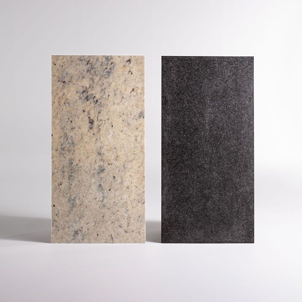 Two sheets of Solidwool materials in white (from Welsh Mountain sheep) and grey/black (from Herdwick sheep).