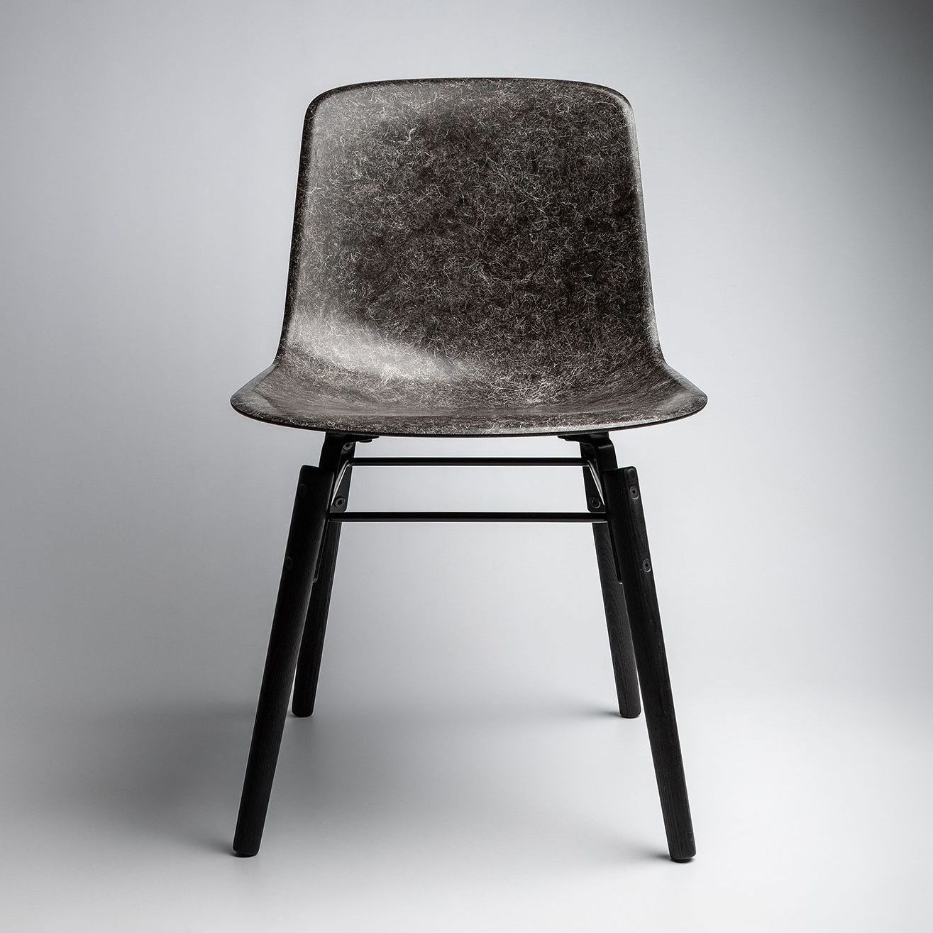 Hembury chair using Herdwick wool with ash legs facing front.