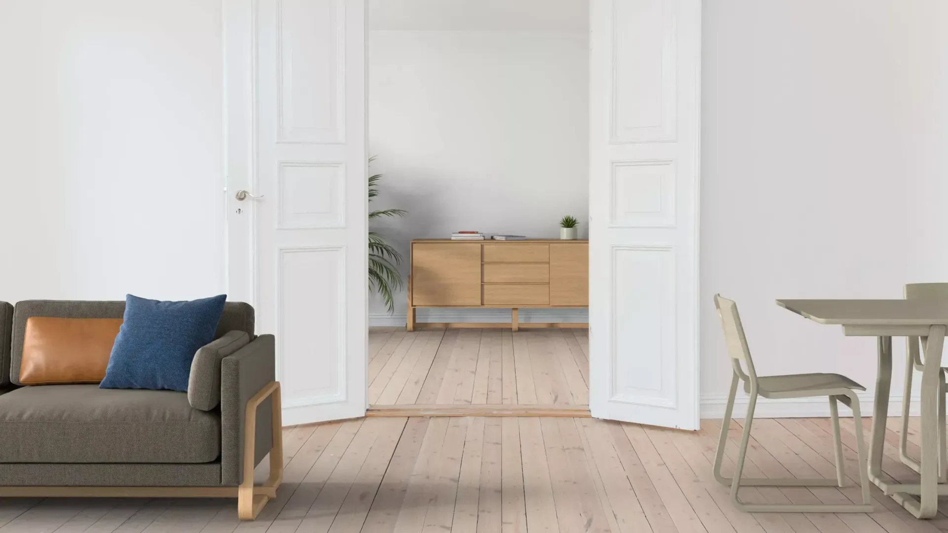 Theo storage drawer is situated at the back of an apartment in a light oak colour. In the living room is a Theo sofa and a table and chairs.