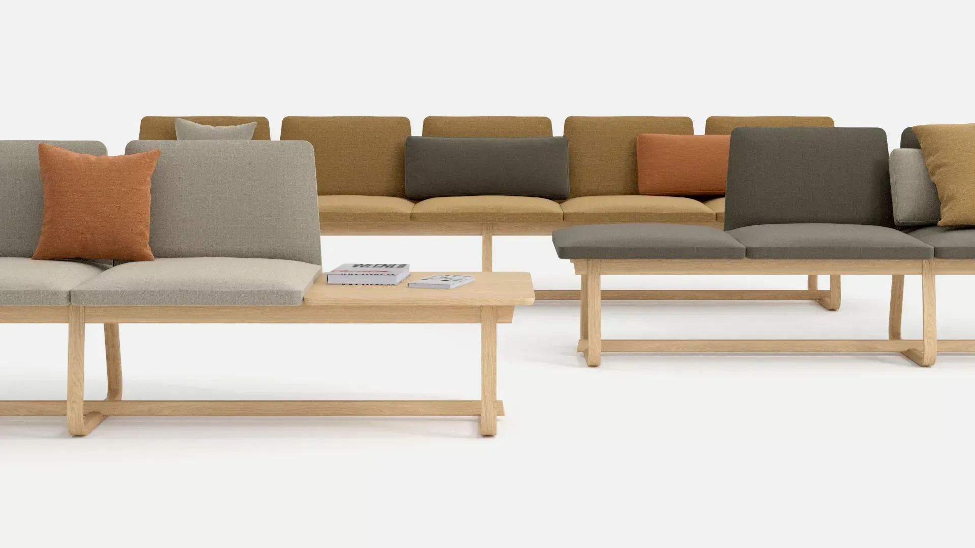 Theo modular soft seating. The sofa in the back is a mustard-yellow, the middle one is a mushroom greige, and the front one is a sandy beige.